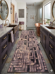 2.8' x 8' runner taupe & brown geometric maze modern area rug placed in a modern bathroom with dual vanities and a freestanding tub.
