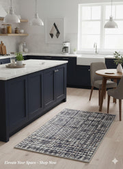 2' x 3' Blue-Gray Ivory Modern Distressed Grid Area Rug placed in a modern farmhouse kitchen beside a wood island. 