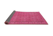 2' x 3' Neon Hot Pink Traditional Persian Runner Rug angled product view highlighting the bold neon pink color and classic patterned design.