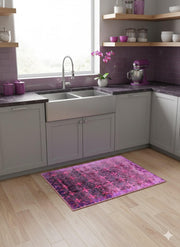 2' x 3' Purple Magenta Pink Modern Distressed Area Rug placed in a bright modern farmhouse kitchen. 