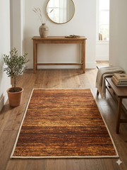 2' x 3' Rectangular Rust Gold Distressed Abstract Modern Washable Area Rug placed in a modern entryway with a wooden console table, round mirror, and natural decor.