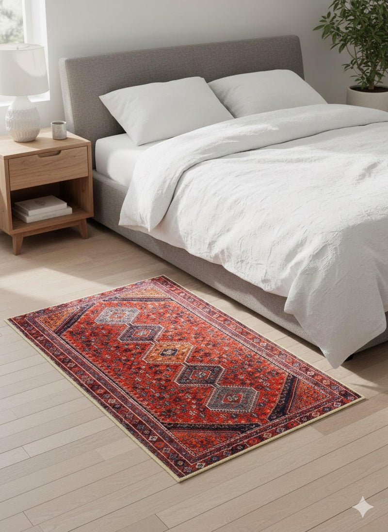 2' x 3' Red Blue Multi Color Geometric Medallion Accent Rug placed in a cozy bedroom setting.