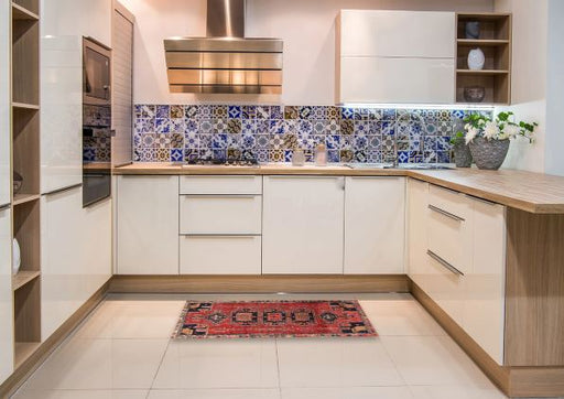 2' x 4' Runner Rust Pink Red Traditional Persian Rug displayed in a modern kitchen setting, highlighting the bold geometric medallion design and rich traditional color palette.