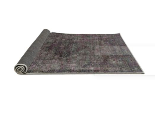 2' x 5' Runner Charcoal Gray & Dusty Purple Modern Oriental Area Rug displayed partially rolled to show the backing.