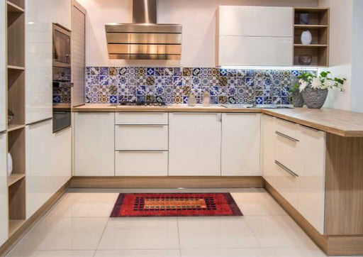 2' x 5' Runner Red Blue Orange Abstract Oriental Rug styled in a modern kitchen, featuring a bold geometric centerpiece with vibrant red, blue, and orange tones.