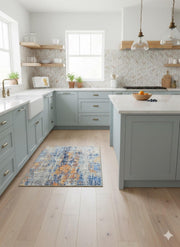 2ft x 3ft Rectangular Blue & Orange Distressed Abstract Modern Area Rug placed in a bright farmhouse kitchen.