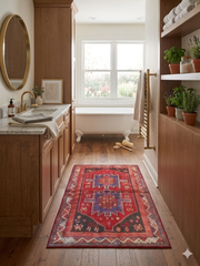 3' x 5' Rectangular Red & Blue Tribal Geometric Southwestern Washable Area Rug placed in a rustic bathroom with wood cabinetry and a freestanding clawfoot tub.