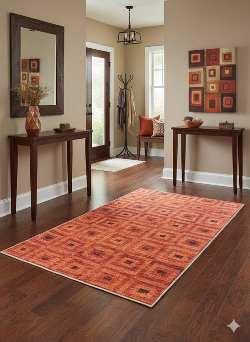 3' x 5' burnt orange geometric area rug styled in a warm entryway with wood floors, console tables, and wall décor.