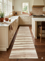 3' x 8' Runner Ivory & Blush Striped Modern Washable Area Rug styled in a warm contemporary kitchen with cream cabinetry, marble countertops, and natural wood flooring.