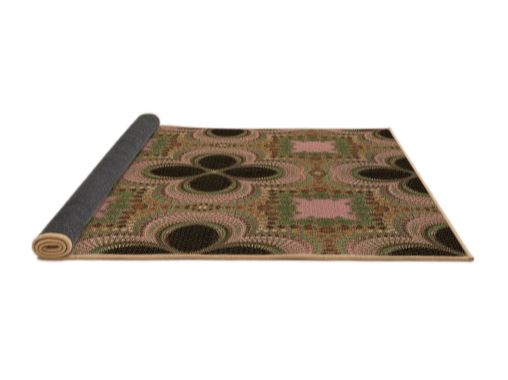 4' x 6' Bronze Brown Pink Patterned Super Soft Cloud Area Rug rolled corner view highlighting the flexible backing and finished edges.