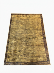 4' x 6' Rectangular Gold Brown Textured Border Modern Area Rug isolated on a white background.