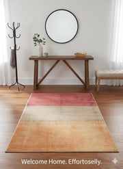 4' x 6' Rectangular Multi Color & Neutral Color-Block Stripe Modern Area Rug styled in a welcoming entryway with a wooden console table, round black mirror, coat rack, bench seating, and warm wood flooring.