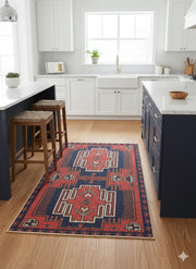 4' x 6' Rectangular Multi Color Southwestern Geometric Area Rug placed in a modern farmhouse kitchen with white cabinetry, navy kitchen island, wooden stools, marble countertops, and soft natural light enhancing the warm, inviting space.