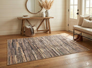 4' x 6' rectangular multi-color & neutral striped modern area rug placed in a bright entryway foyer.