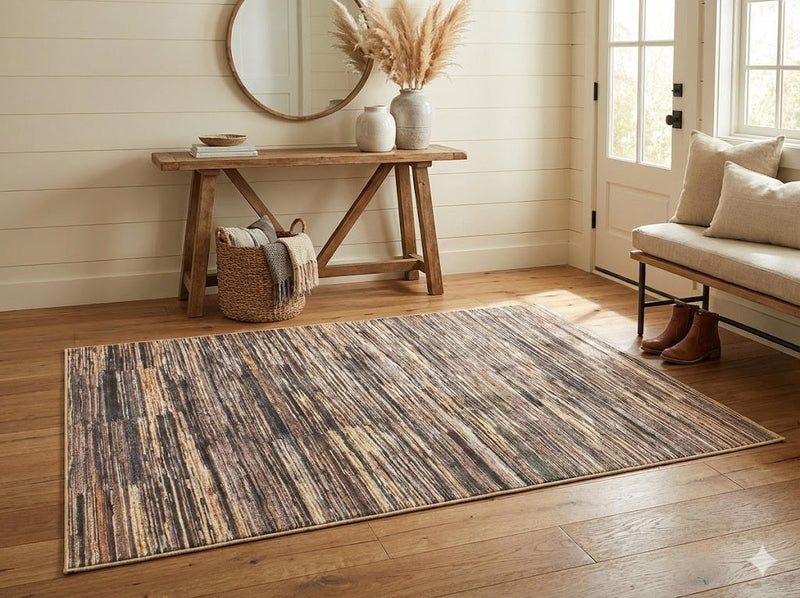 4' x 6' rectangular multi-color & neutral striped modern area rug placed in a bright entryway foyer.