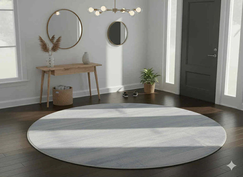 4ft Round Light Blue Contemporary Jeans Modern Area Rug styled in a cozy reading nook with an accent chair and side table, highlighting the soft light blue tones and subtle textured pattern.