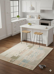4x4 square beige multi-color abstract ikat area rug placed in a bright modern kitchen beneath a white island with wooden stools.