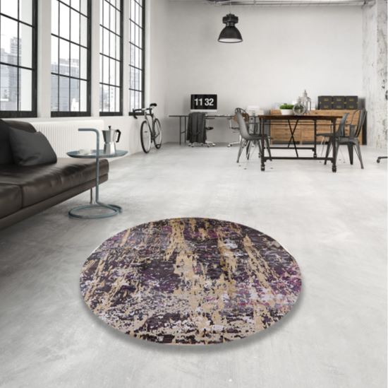 5 ft Round Charcoal Black, Beige & Purple Abstract Distressed Mid-Century Modern Oriental Area Rug styled in a bright industrial living room.