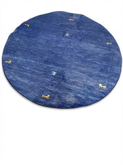 5' round denim blue & soft gold accent minimal motif modern area rug displayed flat on a white background.