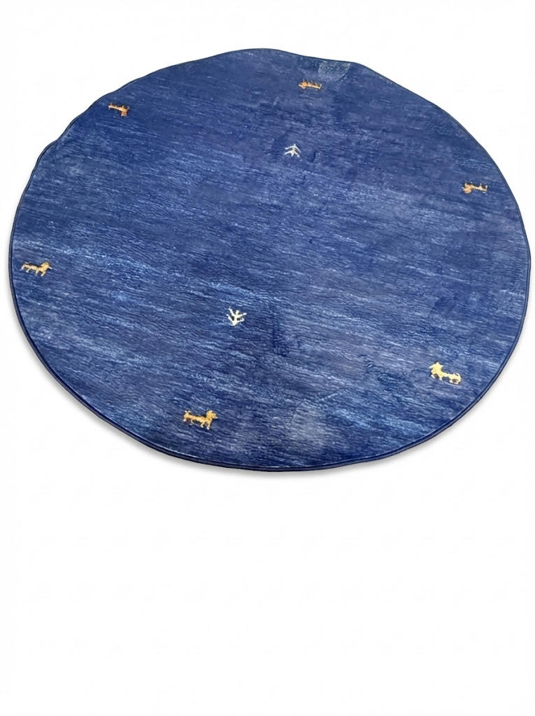 5' round denim blue & soft gold accent minimal motif modern area rug displayed flat on a white background.