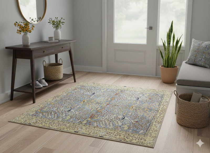 5' x 5' Square Antique Ivory Soft Steel Blue Vintage Floral Area Rug placed in a welcoming entryway with wood floors and console table.