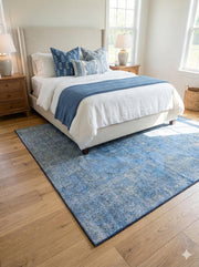 5' x 5' Square Blue Ivory Muted Slate Faint Gray Distressed Area Rug styled in an elegant bedroom with wood nightstands.
