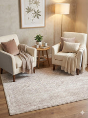 5' x 5' square ivory & soft beige subtle diamond modern area rug styled in a cozy seating area.