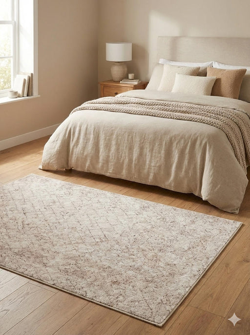 5' x 5' square ivory & soft beige subtle diamond modern area rug styled in a serene bedroom.