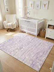 5' x 5' square soft lilac & pale cream floral watercolor modern area rug styled in a light-filled nursery with a white crib, soft textiles, and neutral wood flooring