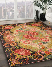 5' x 7' Black Multi Color Traditional Medallion Area Rug angled close-up displaying the intricate border pattern and colorful floral details.
