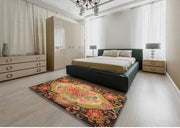 5' x 7' Black Multi Color Traditional Medallion Area Rug styled in a bedroom setting, showing how the vibrant traditional design complements neutral furniture.