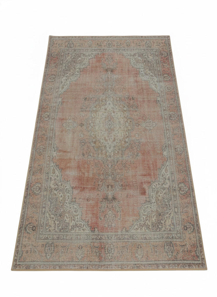 5' x 7' Blush & Beige Ivory Light Taupe Distressed Traditional Area Rug placed in a cozy room with natural lighting. 
