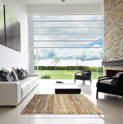 5' x 7' Dark Gold Brown Beige Striped Contemporary Modern Rug staged in a bright living room, demonstrating how the neutral stripes enhance a modern interior space.
