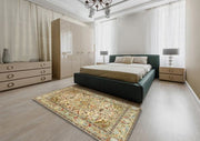 5' x 7' Ivory Multi Color Floral Medallion Traditional Persian Area Rug placed in a contemporary bedroom at the foot of a bed with neutral furnishings and soft lighting.