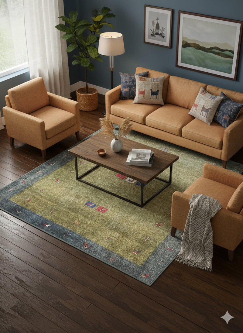5' x 7' Olive Green & Slate Blue Minimalist Border Area Rug placed in a cozy living room with light wood flooring and natural light 
streaming through the windows.
