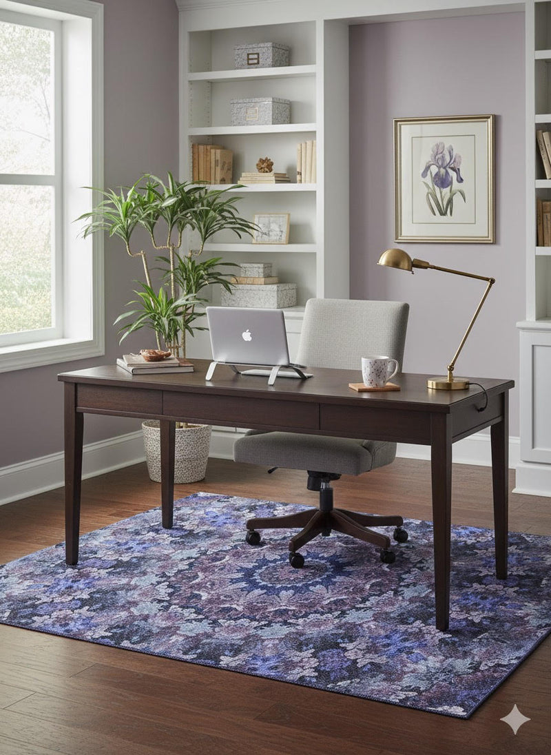 5' x 7' Purple Indigo Blue Floral Medallion Vintage-Style Area Rug displayed in a bright home office with a wooden desk, modern chair, and decorative shelving.
