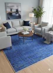 5' x 7' Rectangle Blue & Charcoal Abstract Modern Area Rug styled in a contemporary living room.