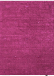 5' x 7' Rectangle Magenta Purple Minimalist Solid Area Rug close-up view highlighting the soft texture and subtle minimalist stitched accents on the magenta surface.