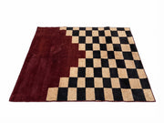 5' x 7' Rectangular Burgundy Black & Beige Checkered Geometric Modern Area Rug featuring a rich burgundy solid section and contrasting black and beige checkerboard pattern.