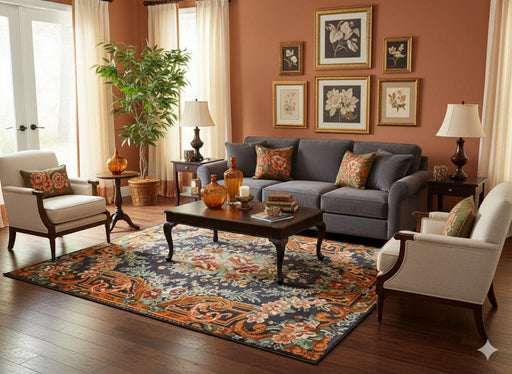 5' x 7' Rectangular Charcoal & Rust Orange Floral Traditional Area Rug styled in a living room with a dark gray sofa and wooden coffee table.