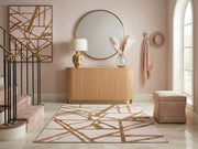 5' x 7' Rectangular Ivory & Gold Blush Geometric Abstract Modern Washable Area Rug styled in an elegant entryway with a fluted console table and round gold mirror.