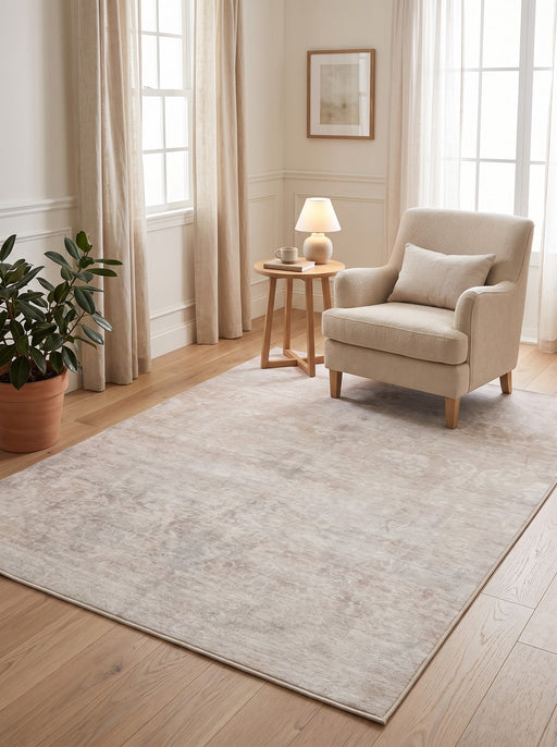 5' x 7' Rectangular Ivory & Light Gray Distressed Floral Vintage Traditional Area Rug styled in a cozy reading nook with a cream armchair and wooden side table.