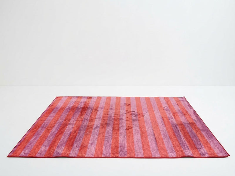 5' x 7' Rectangular Pink & Orange Purple Striped Abstract Modern Area Rug featuring vibrant coral orange, pink, and lavender stripes with a distressed textured effect.