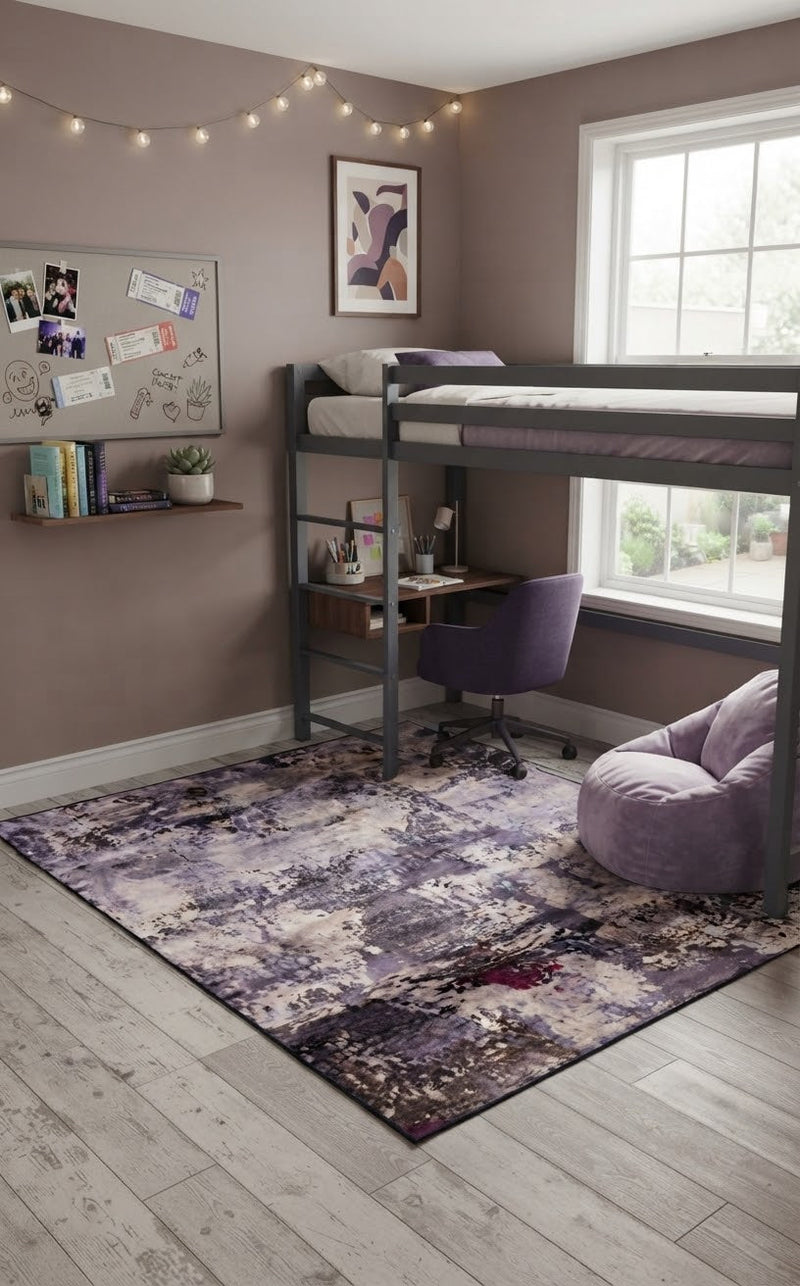 5' x 7' Rectangular Purple Lavender Gray Distressed Abstract Modern Area Rug placed in a bedroom with a gray loft bed and purple accent chair.