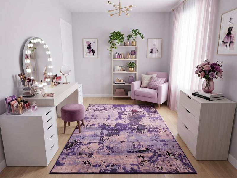 5' x 7' Rectangular Purple & Lavender Pink Distressed Abstract Modern Area Rug styled in a vanity room with a white makeup desk and lavender armchair.