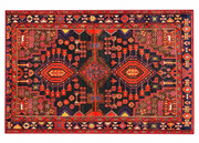 5' x 7' Rectangular Red & Navy Blue Tribal Geometric Southwestern Area Rug featuring bold geometric medallions, intricate tribal motifs, and a decorative border with rust orange and gold accents.