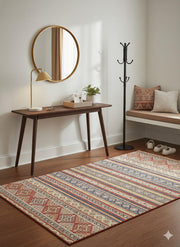 5' x 7' Rectangular Rust Red & Blue Striped Tribal Geometric Southwestern Washable Area Rug styled in an entryway with a wooden console table and cushioned bench.