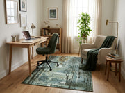 5' x 7' Rectangular Teal Green & Ivory Forest Pictorial Modern Washable Area Rug styled in a home office with a wooden desk and green office chair.