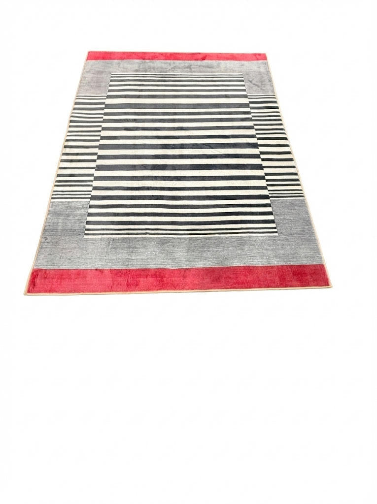 5' x 7' black, ivory, and red modern striped rectangular area rug featuring bold horizontal stripes and a color-blocked border on a clean white background.