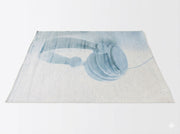 5' x 7' ivory and dusty blue abstract modern rectangular area rug featuring a soft abstract headphone-inspired design on a clean white background.